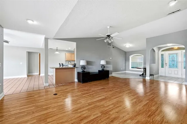 a kitchen with stainless steel appliances kitchen island granite countertop a sink and cabinets