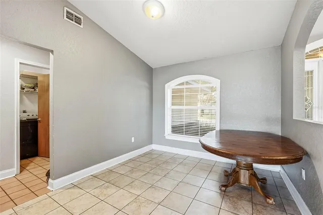 a view of a living room and kitchen with granite countertop tops