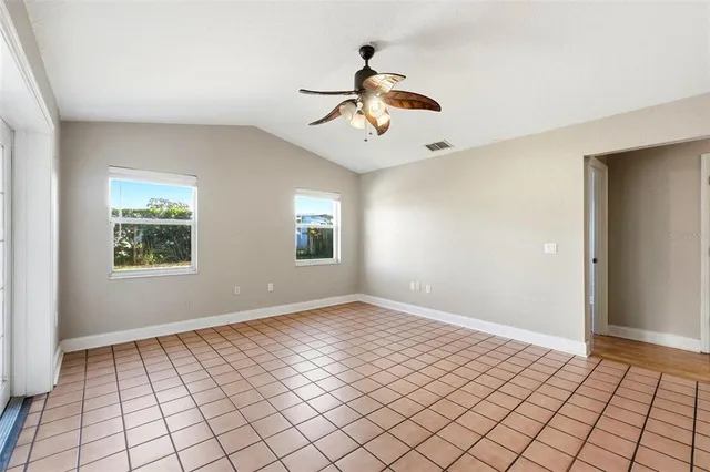 a kitchen with granite countertop a stove top oven a sink dishwasher a refrigerator and a microwave