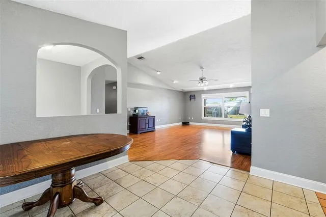 a kitchen with stainless steel appliances granite countertop a sink stove microwave and cabinets