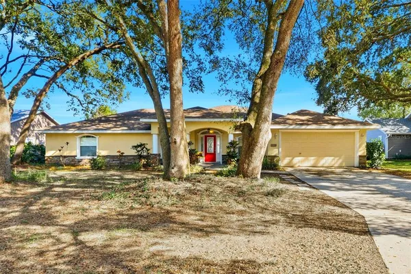 a view of a house with a snow in the yard