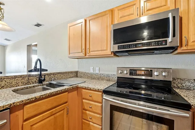 a white refrigerator freezer sitting inside of a kitchen