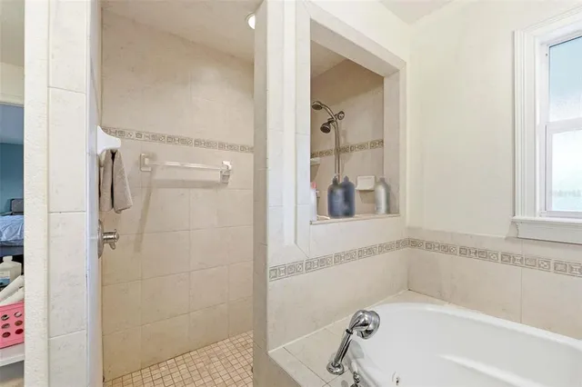 a bedroom with a bed and furniture