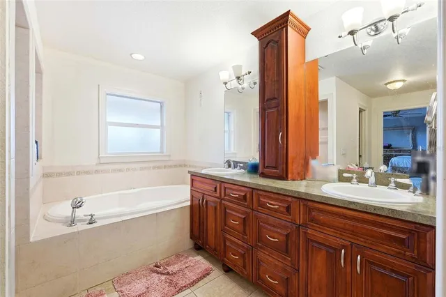 a bedroom with a bed and ceiling fan