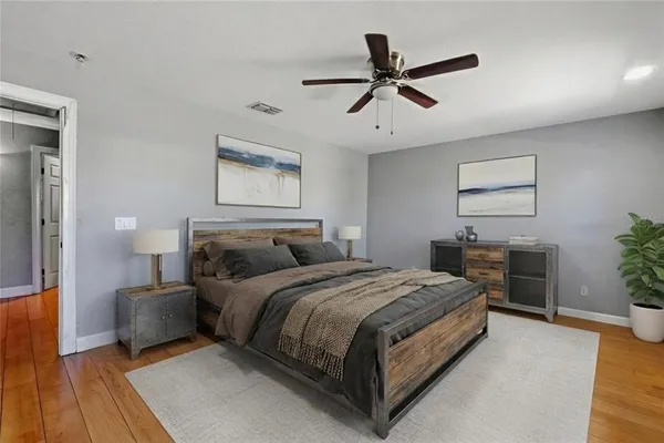 a bedroom with a bed and furniture