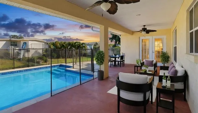 a view of a patio with swimming pool