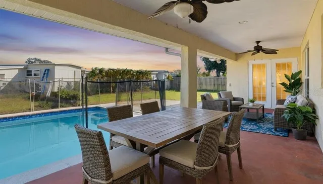 a lobby with furniture and floor to ceiling window