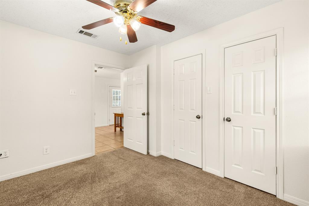 375 Panther Branch Road Valley Mills, TX 76689 - Photo 15 of 34 an empty room with closet and a chandelier fan