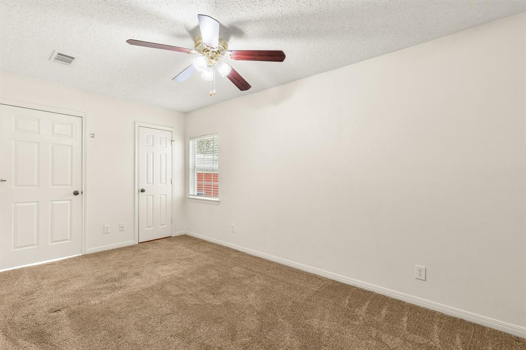 375 Panther Branch Road Valley Mills, TX 76689 - Photo 16 of 34 an empty room with a window and a fan