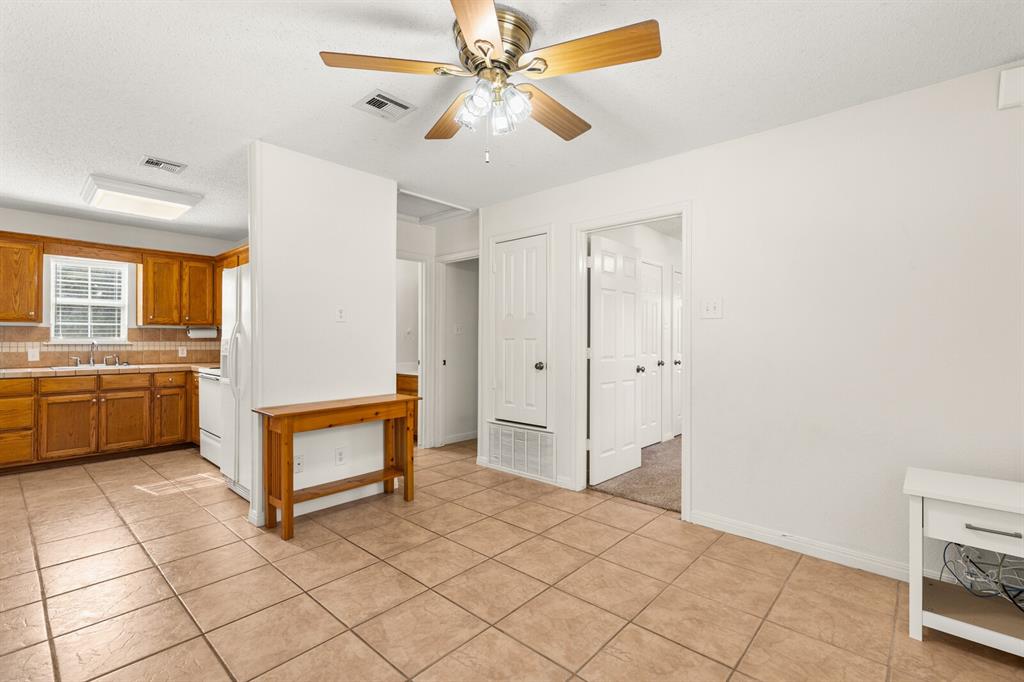 375 Panther Branch Road Valley Mills, TX 76689 - Photo 8 of 34 a view of a kitchen with a sink and a stove top oven