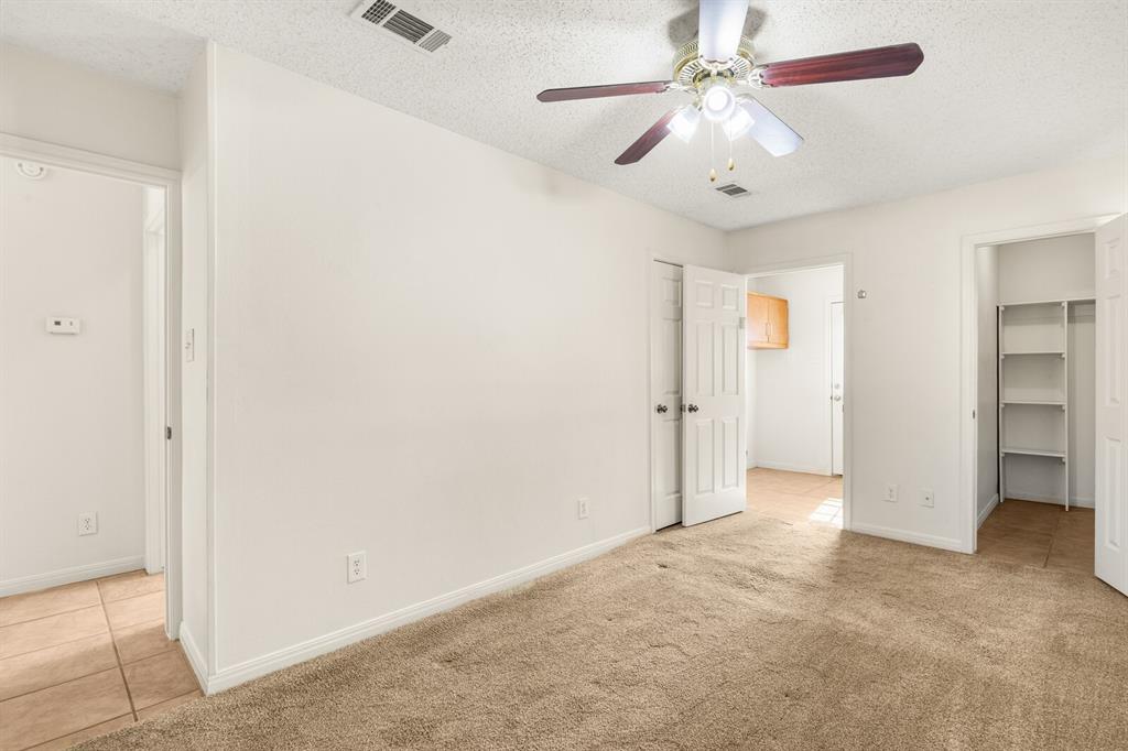 375 Panther Branch Road Valley Mills, TX 76689 - Photo 10 of 34 an empty room with chandelier fan and closet
