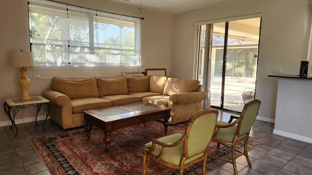 a living room with furniture and a window