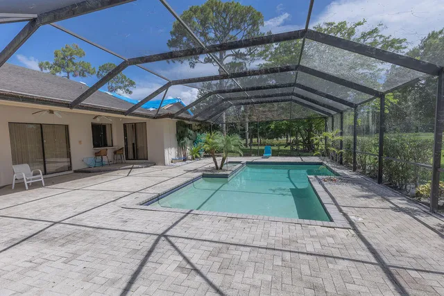 a view of a backyard with a patio