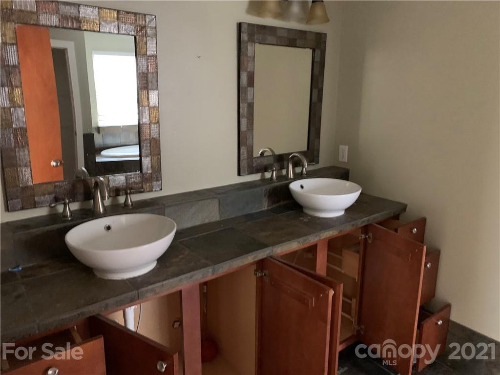 8060 Summit Ridge Drive Catawba, NC 28609 - Photo 19 of 32 a bathroom with a granite countertop sink a mirror and a