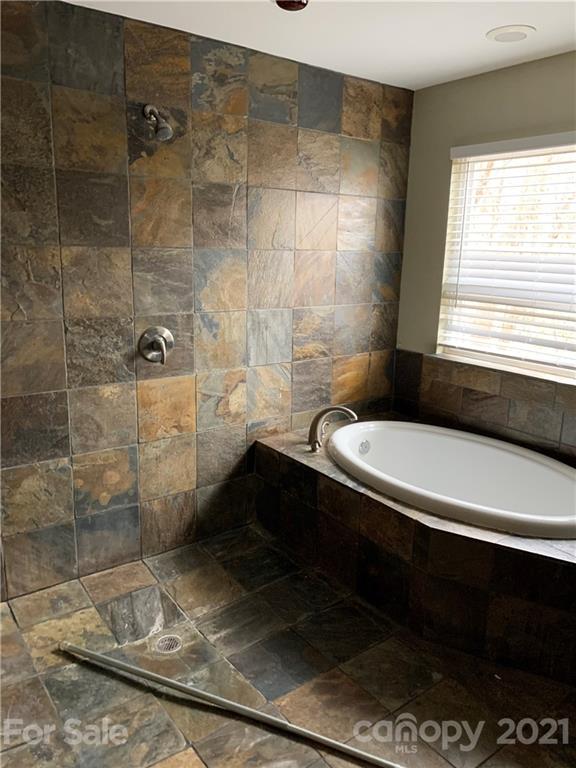 8060 Summit Ridge Drive Catawba, NC 28609 - Photo 20 of 32 a bathroom with a granite countertop sink a toilet and shower