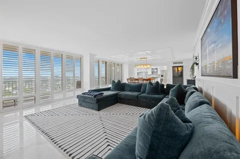 a large bedroom with a large bed and a large window