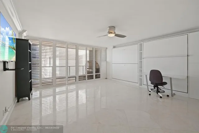a view of a room with racks on the wall and a window