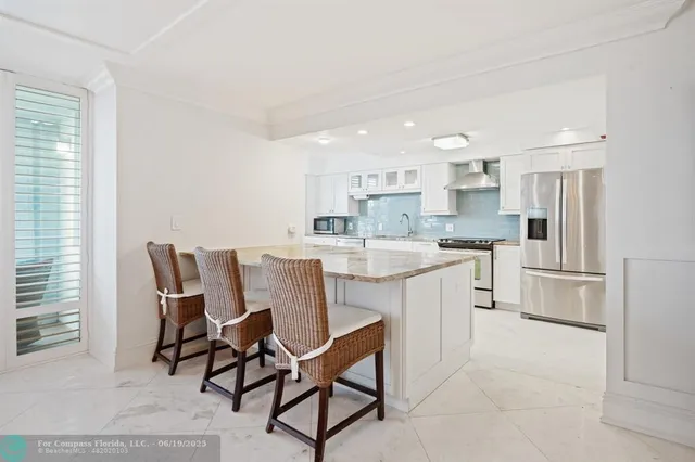 a view of swimming pool with outdoor seating and city view