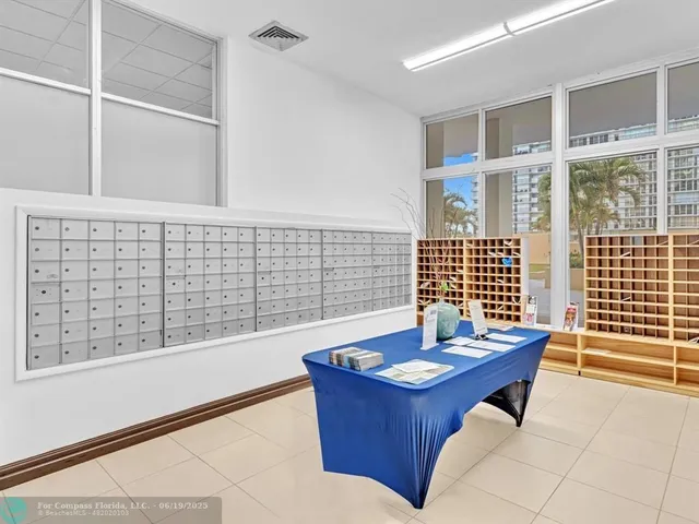 a living room with lots of chairs and a table
