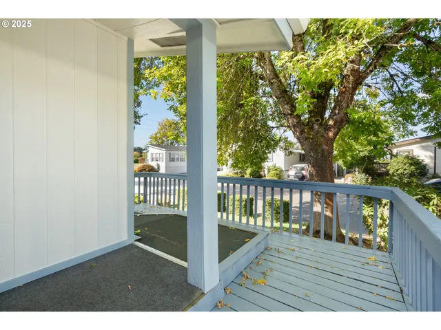 a view of balcony with wooden floor