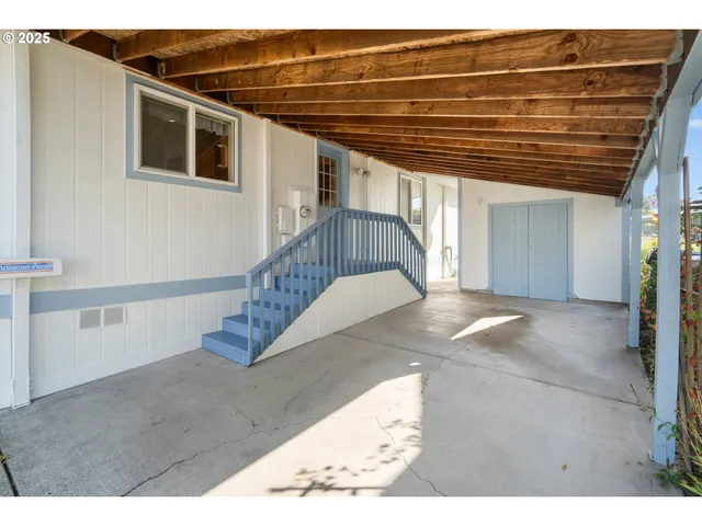 a view of entryway with wooden stairs