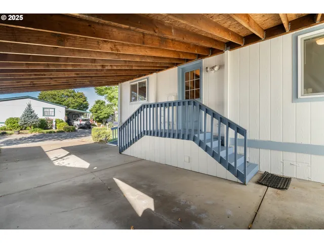 a view of entryway with a floor to ceiling window and stairs
