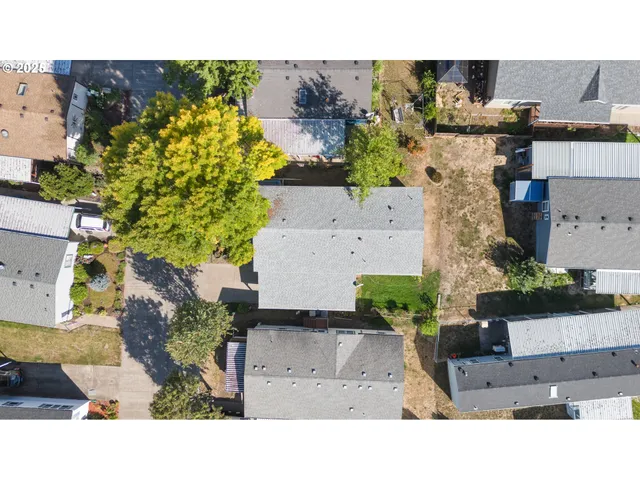 an aerial view of a house with a garden