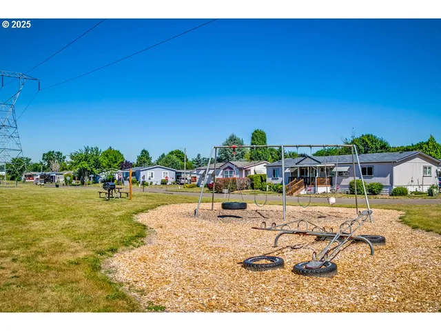 a swimming pool with outdoor seating and yard
