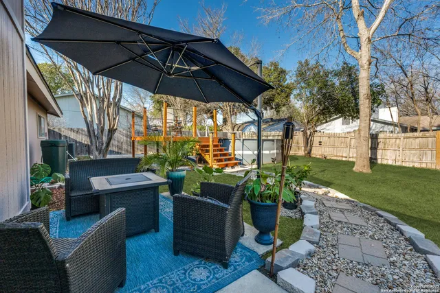 a view of a swimming pool with a patio
