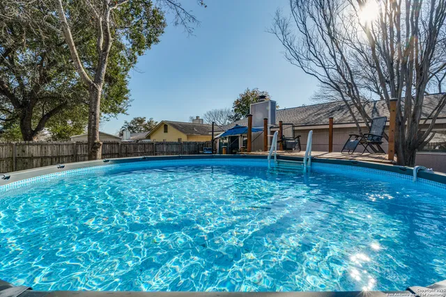 a front view of a house with a yard table and chairs