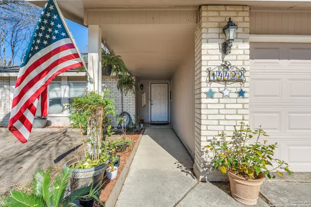 a view of entryway with flower pots