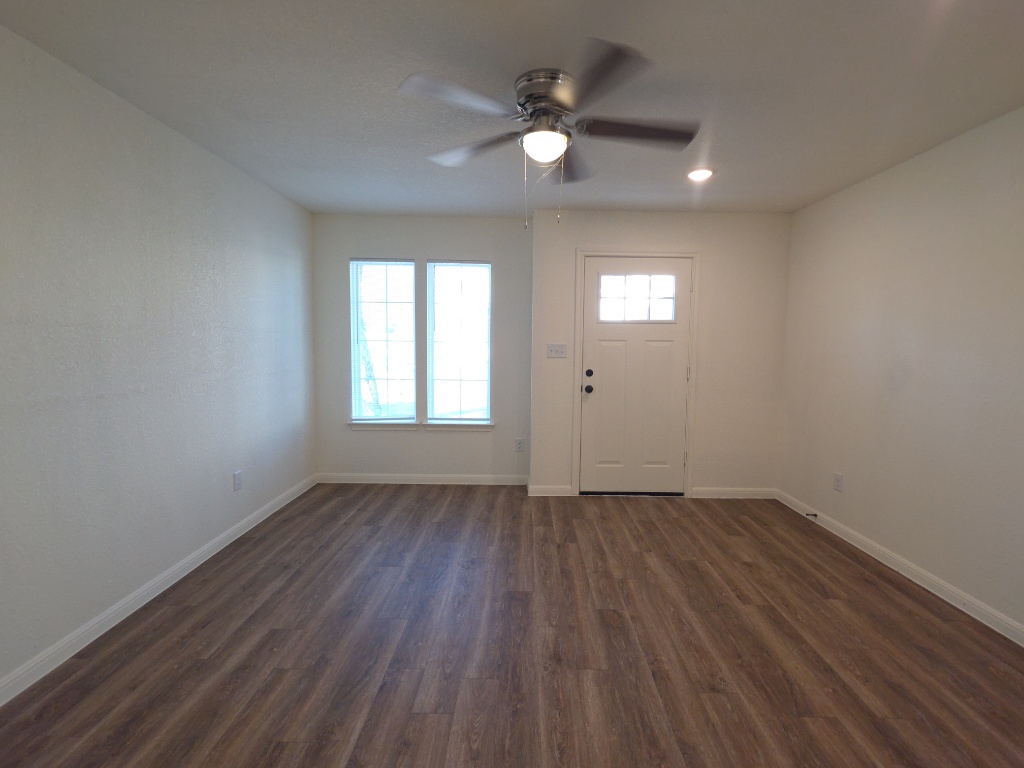 2002 West 2nd Street, Unit 1200 Taylor, TX 76574 - Photo 3 of 11 Living room with ceiling fan