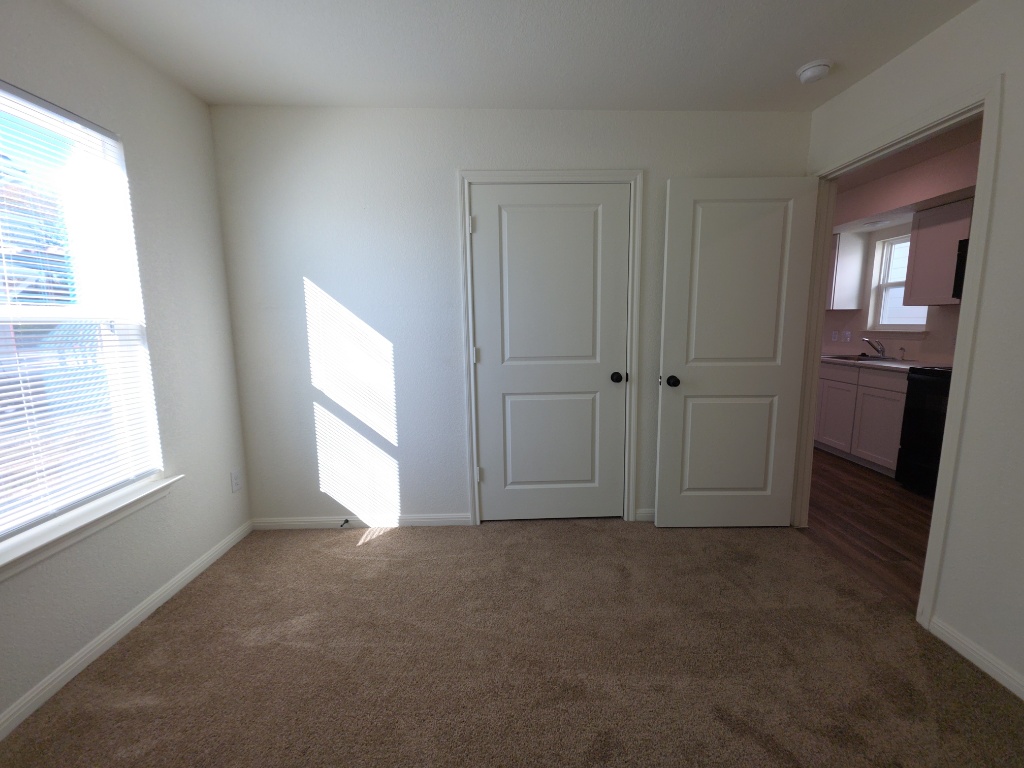 2002 West 2nd Street, Unit 1200 Taylor, TX 76574 - Photo 7 of 11 Primary bedroom with closet and natural light