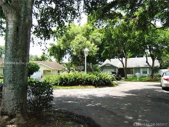 15120 Southwest 141st Place Miami, FL 33186 - Photo 2 of 13 a view of road and trees