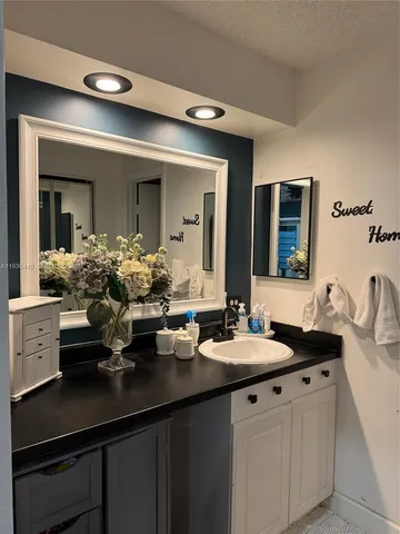 a bathroom with a sink double vanity and a mirror