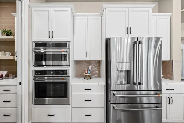 a kitchen with appliances and cabinets
