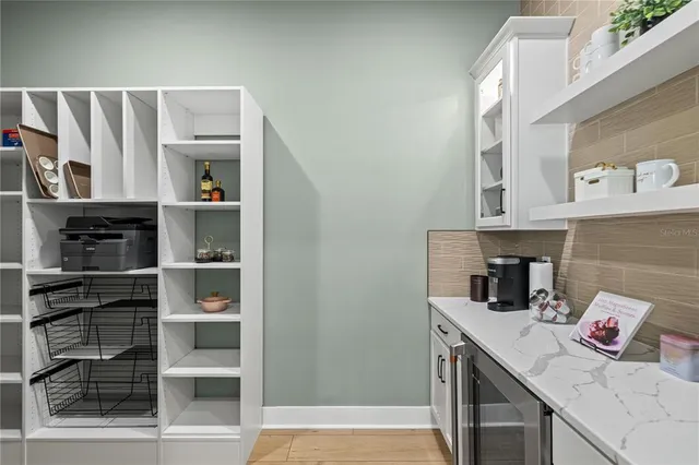 a kitchen with a cabinets and window