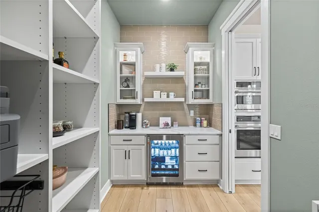 a view of cabinets and wooden floor
