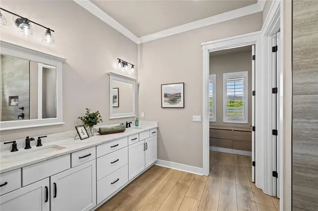 a spacious bathroom with double vanity sink and a mirror