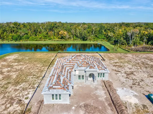 a view of a brick house with a yard