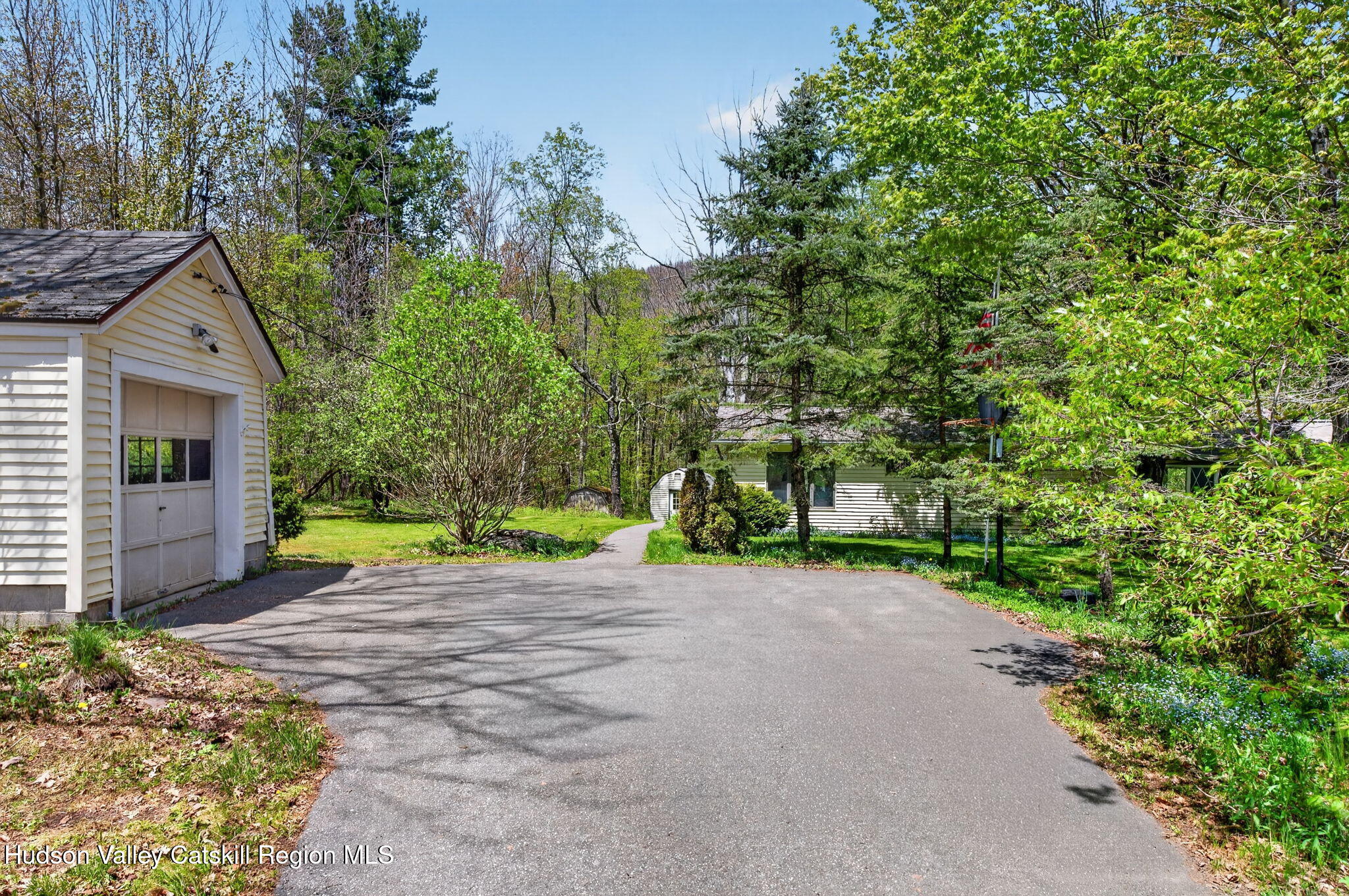 689 Old Road Windham, NY 12496 - Photo 24 of 42 a view of a house with potted plants and large trees