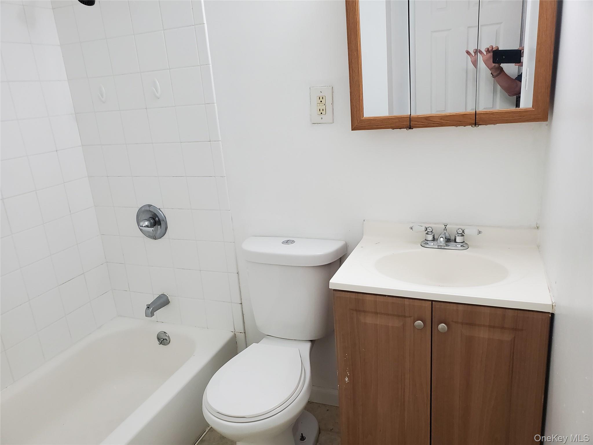 10 Sally Lane Ridge, NY 11961 - Photo 7 of 7 a bathroom with a sink a toilet and shower