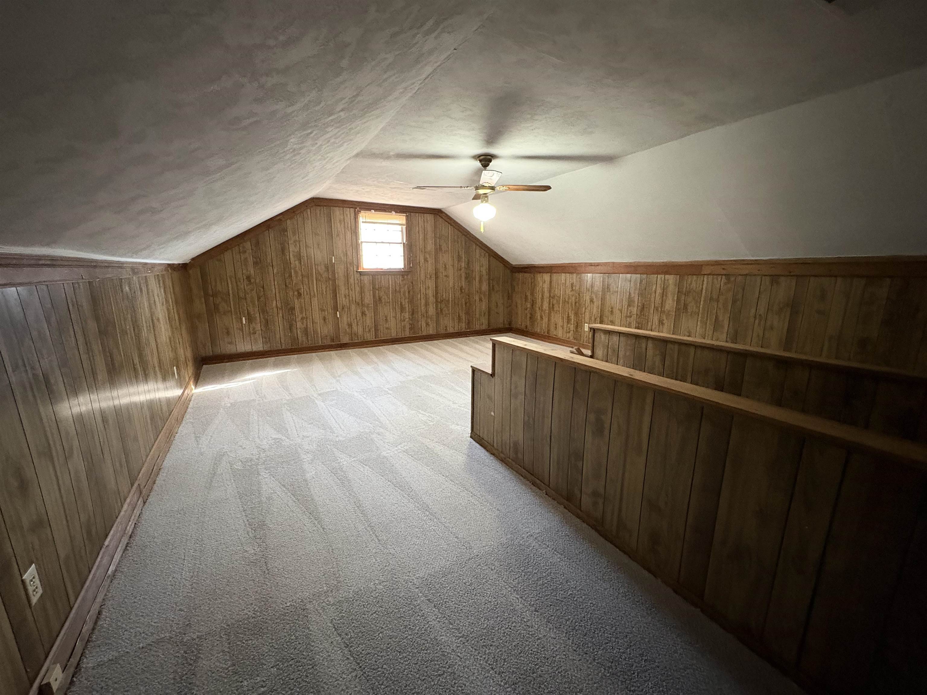 6985 Fords Station Road, Unit 41 Germantown, TN 38138 - Photo 18 of 20 Bonus room featuring wood walls, a ceiling fan, and light colored carpet