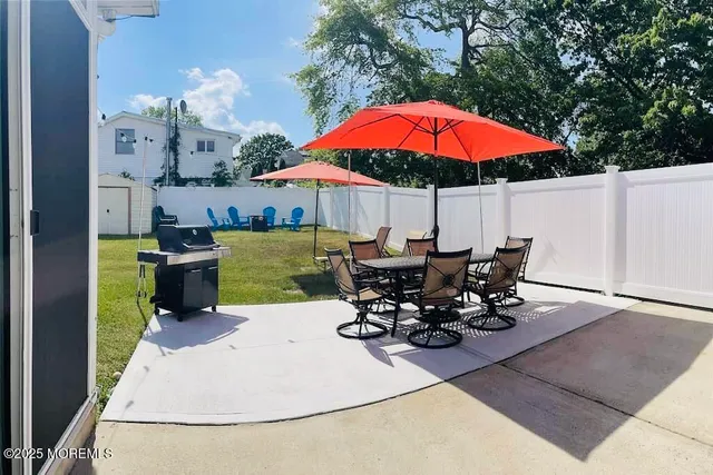 an outdoor space with furniture and umbrella