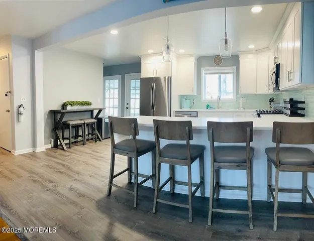 a dining area with furniture and window