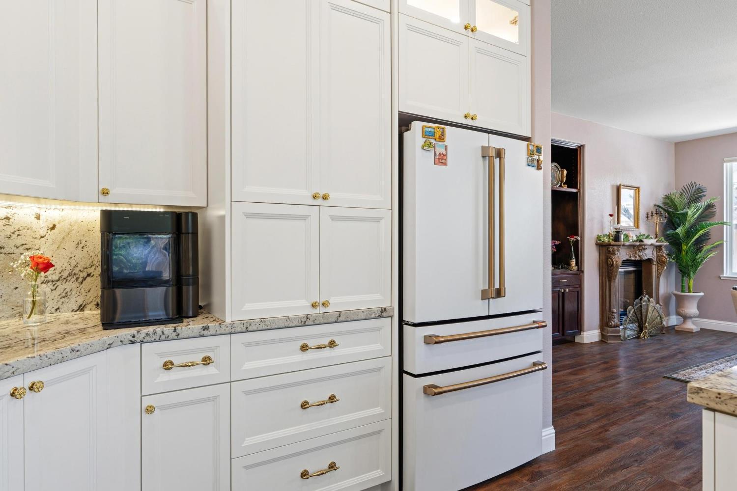 426 South Highland Avenue Ripon, CA 95366 - Photo 24 of 82 a kitchen with stainless steel appliances white cabinets and wooden floor