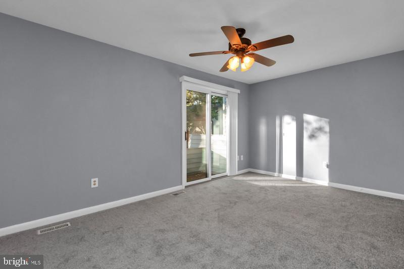 1065 Cedar Ridge Court Annapolis, MD 21403 - Photo 12 of 22 a view of a livingroom with a ceiling fan and window