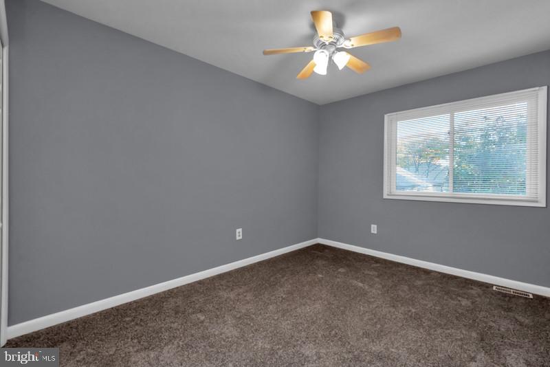 1065 Cedar Ridge Court Annapolis, MD 21403 - Photo 16 of 22 an empty room with a window and a fan