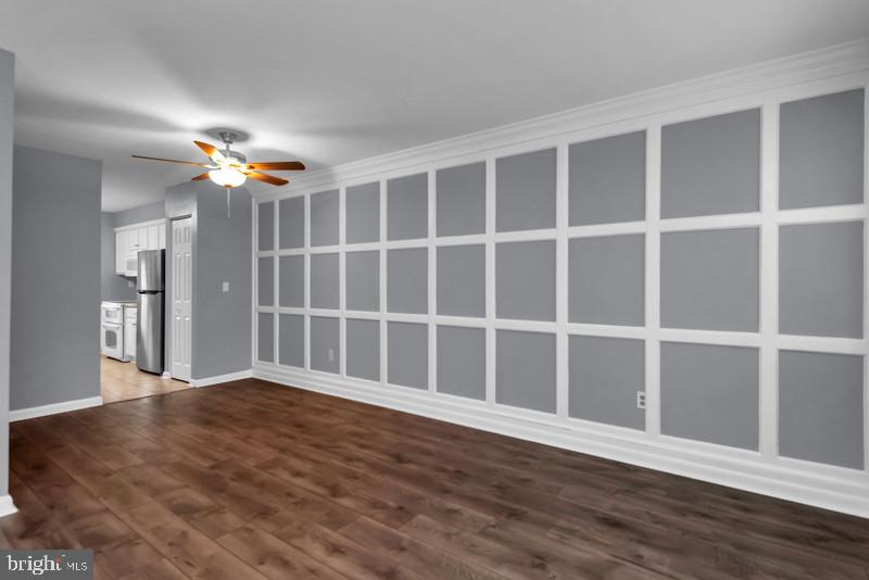 1065 Cedar Ridge Court Annapolis, MD 21403 - Photo 6 of 22 a view of an empty room with a window and wooden floor