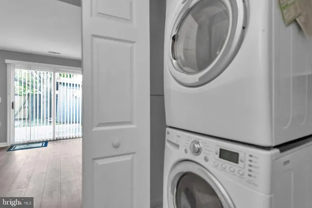 a view of a hallway with washer and dryer
